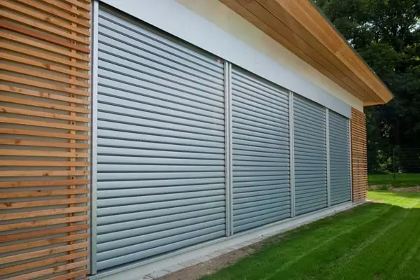 House with roller shutters on balcony doors for security